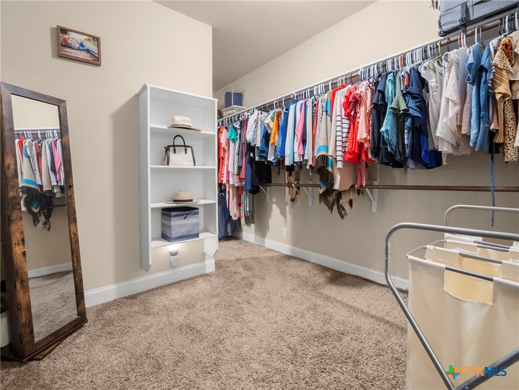 28415 Willis Ranch San Antonio, TX 78260 - Photo 20 of 48 a view of walk in closet with clothes and shoes