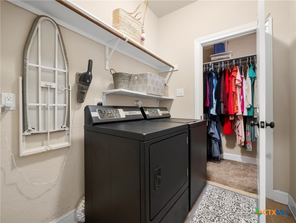 28415 Willis Ranch San Antonio, TX 78260 - Photo 21 of 48 a view of walk in closet with clothes and shoes