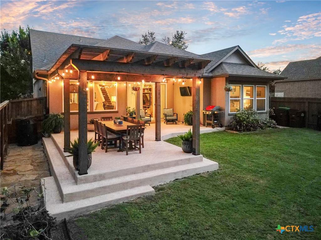 28415 Willis Ranch San Antonio, TX 78260 - Photo 31 of 48 a patio with table and chairs