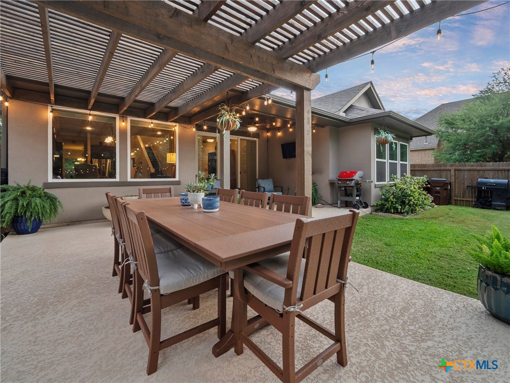 28415 Willis Ranch San Antonio, TX 78260 - Photo 32 of 48 a view of a patio with a table and chairs