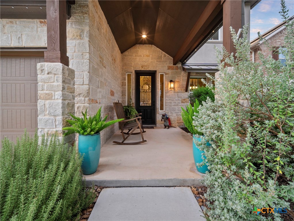 28415 Willis Ranch San Antonio, TX 78260 - Photo 4 of 48 a view of a house with potted plants and more windows