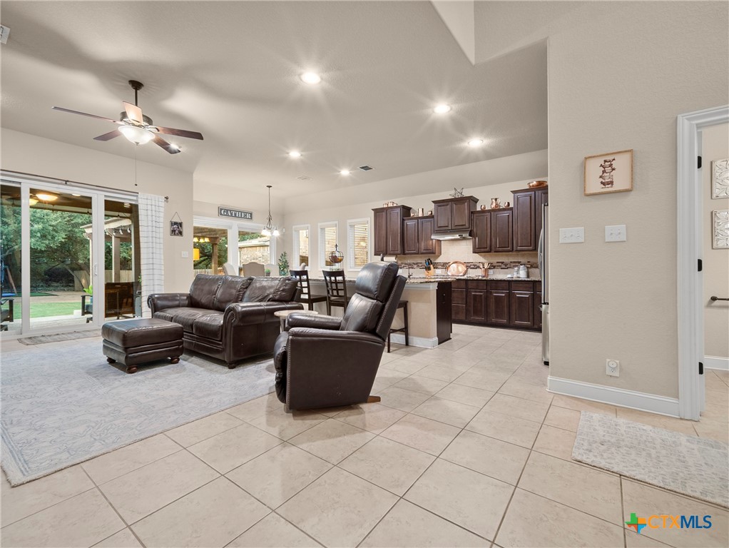 28415 Willis Ranch San Antonio, TX 78260 - Photo 5 of 48 a living room with furniture a flat screen tv and a window