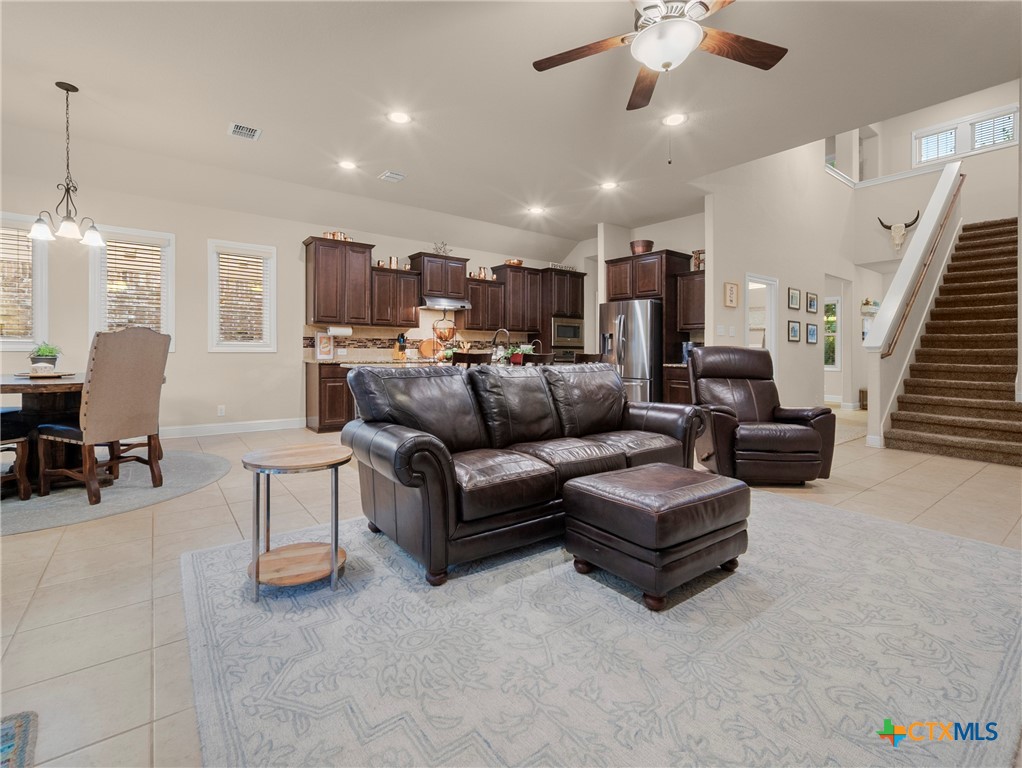28415 Willis Ranch San Antonio, TX 78260 - Photo 6 of 48 a living room with furniture and a chandelier