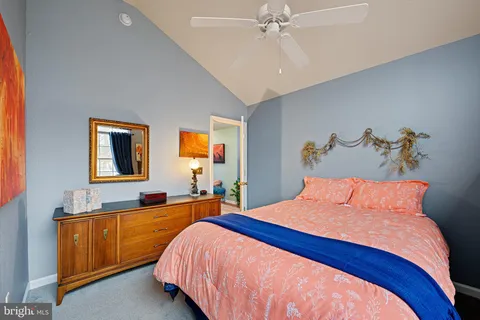 a bed room with a bed and a chandelier