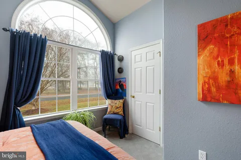 a bathroom with a sink vanity mirror and toilet
