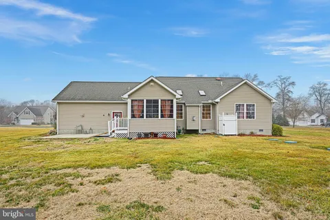 a view of open pool with green space