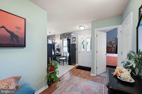 a living room with furniture and flowers