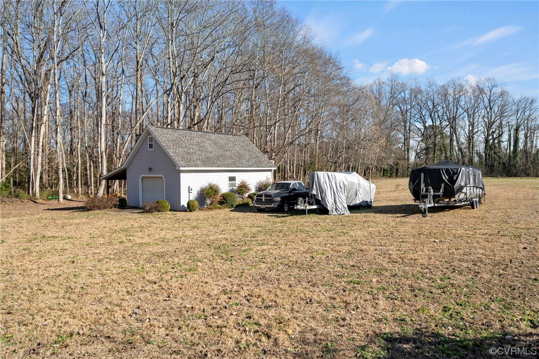 0 Parrotts Cove Road Water View, VA 23180 - Photo 4 of 4 a front view of a house with a yard covered in snow