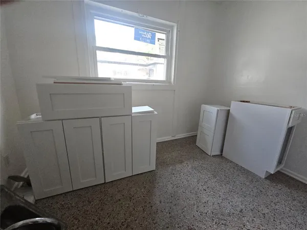 a view of an empty room with a window