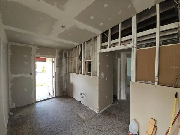 a view of a hallway with wooden shelves