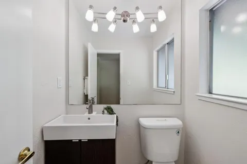 a bathroom with a sink vanity and a mirror