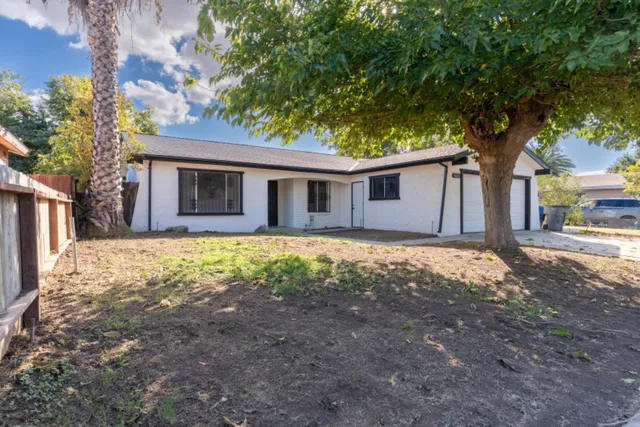 a house with trees in the background