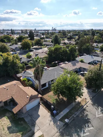 an aerial view of a house with a garden