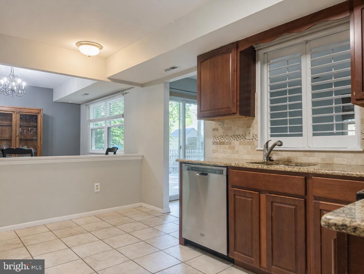 2 Goshawk Court Voorhees, NJ 08043 - Photo 12 of 33 a kitchen with granite countertop a sink and a stove