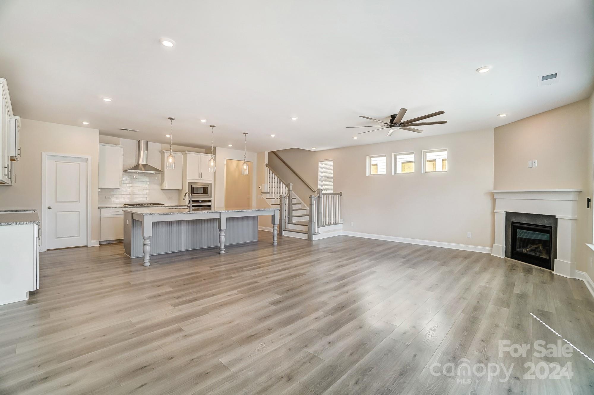 2059 Suttonview Road Fort Mill, SC 29708 - Photo 13 of 44 a view of kitchen with furniture and fireplace