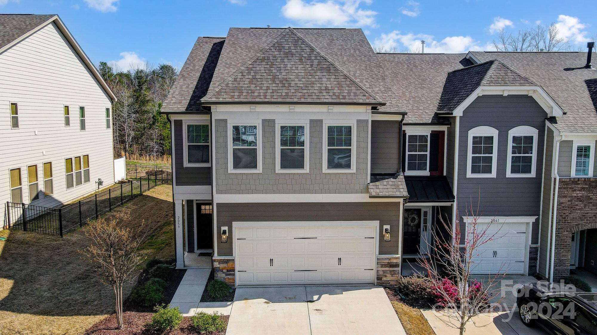 2059 Suttonview Road Fort Mill, SC 29708 - Photo 2 of 44 a front view of a house with a garage