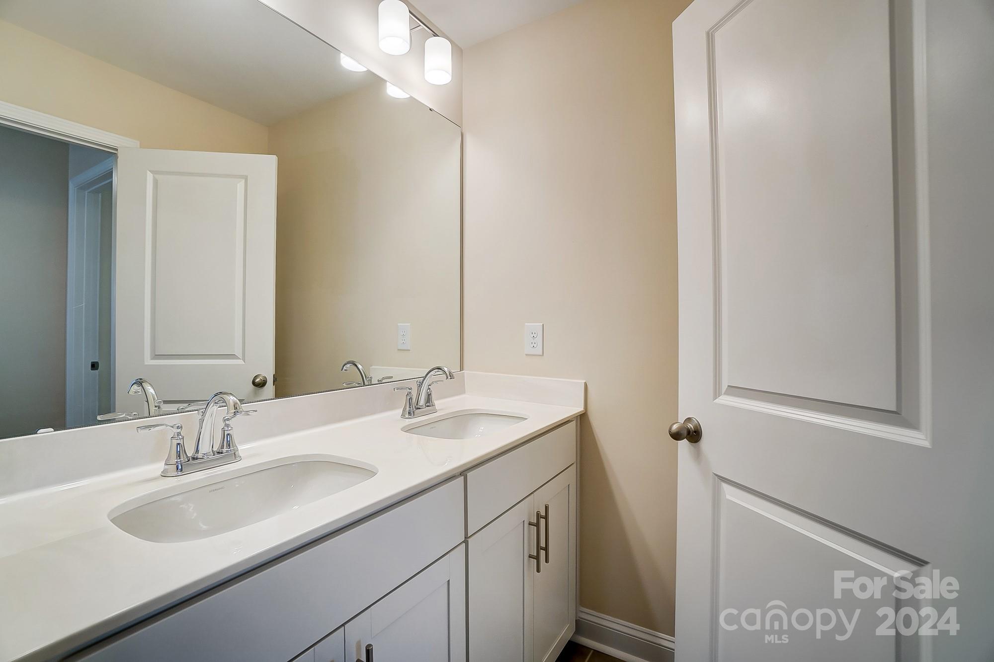 2059 Suttonview Road Fort Mill, SC 29708 - Photo 37 of 44 a bathroom with a sink and a mirror