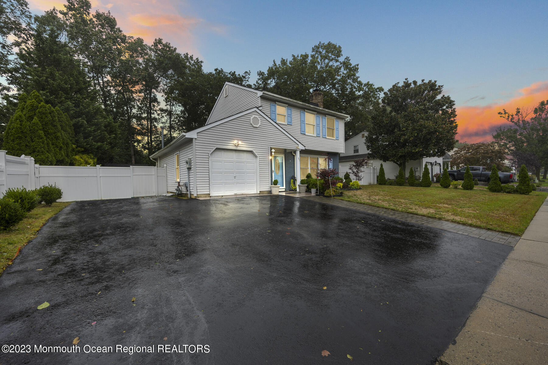 12 Constitution Drive Howell, NJ 07731 - Photo 1 of 39 a front view of a house with a yard and lake view