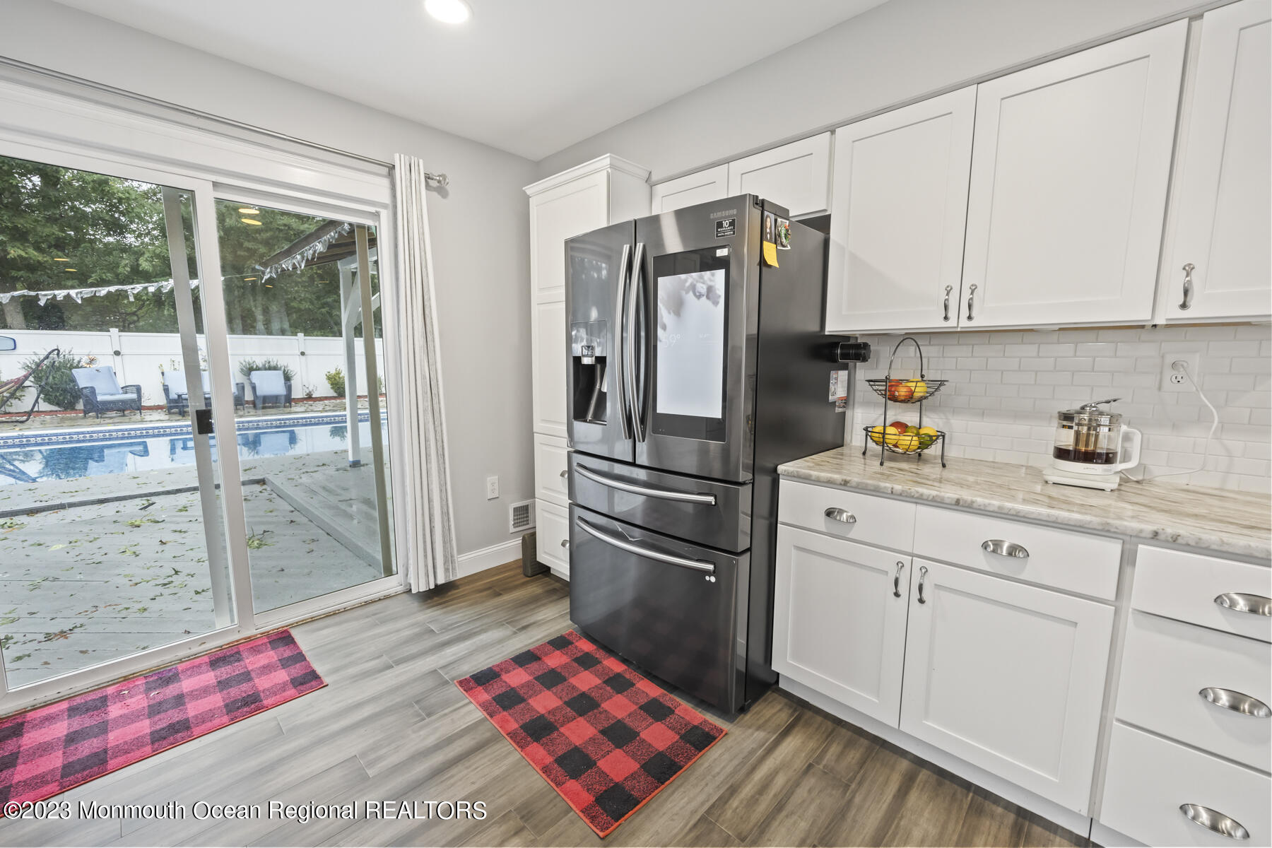 12 Constitution Drive Howell, NJ 07731 - Photo 13 of 39 a kitchen with a refrigerator and countertop