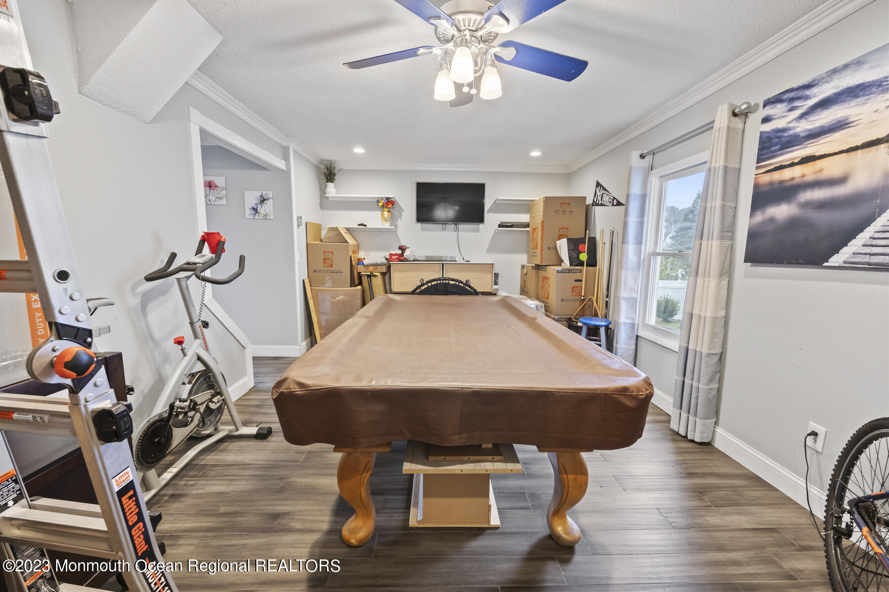12 Constitution Drive Howell, NJ 07731 - Photo 22 of 39 a living room with furniture and a flat screen tv