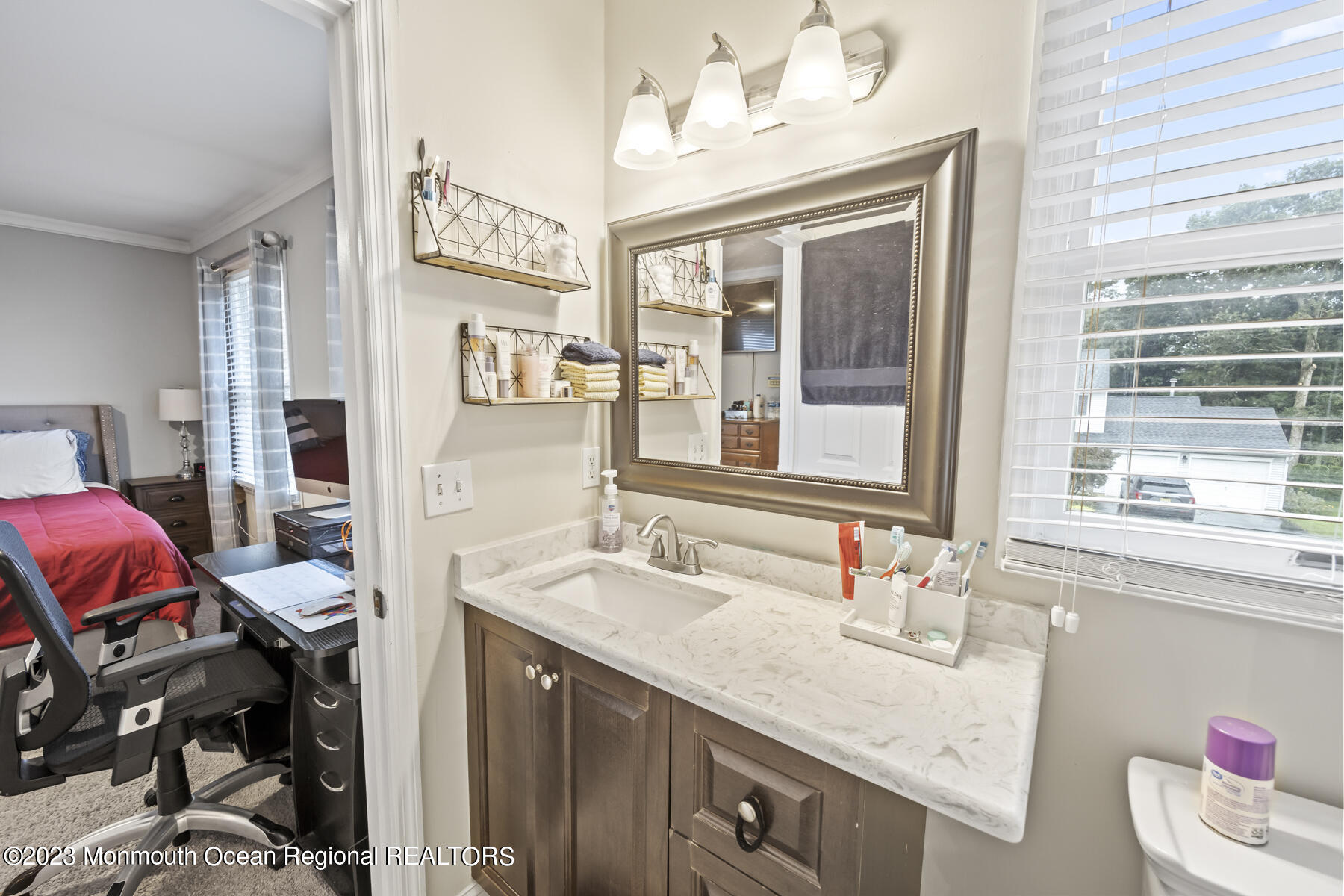 12 Constitution Drive Howell, NJ 07731 - Photo 24 of 39 a en suite bathroom with a granite countertop sink and a mirror