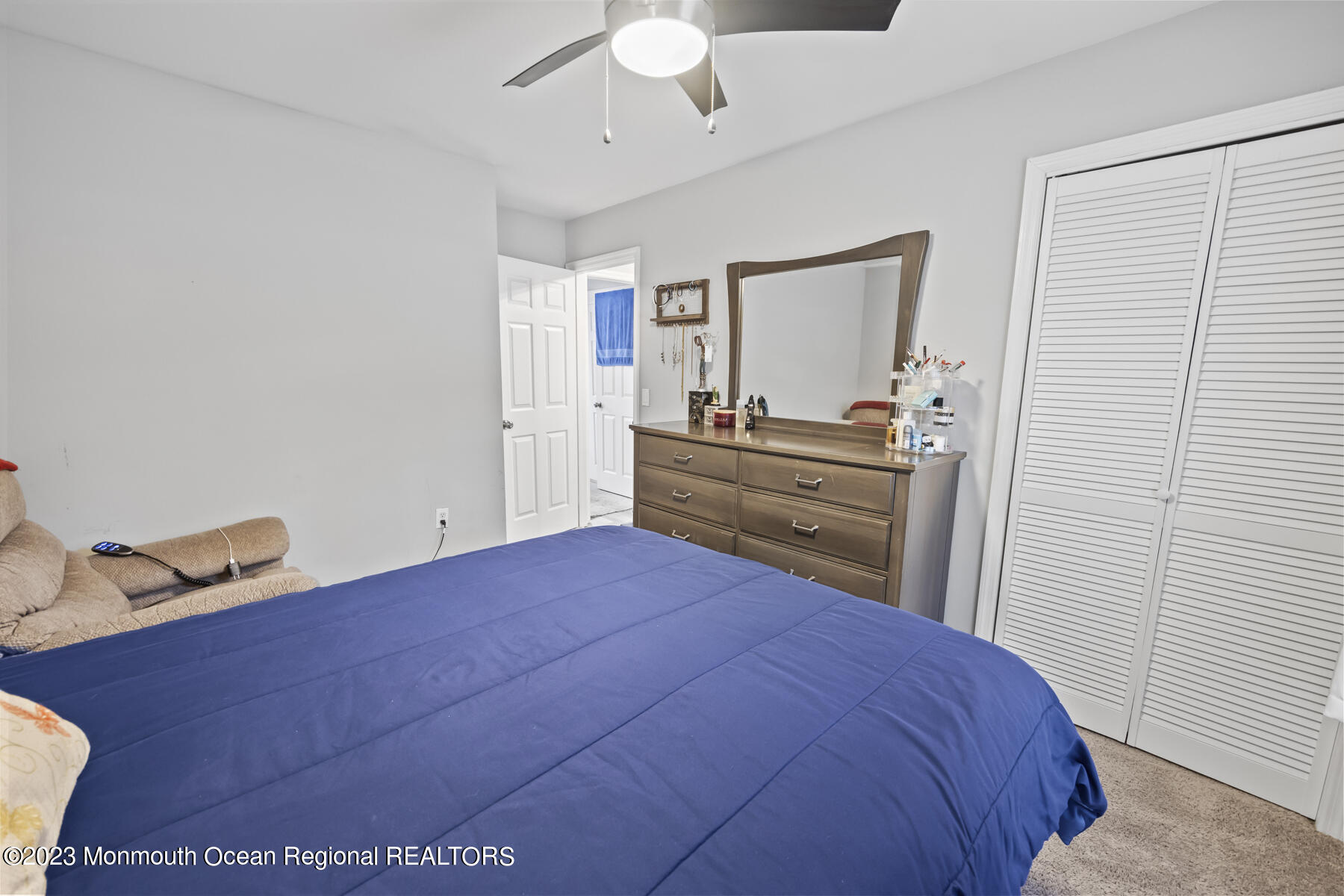 12 Constitution Drive Howell, NJ 07731 - Photo 26 of 39 a bedroom with a bed and a dresser