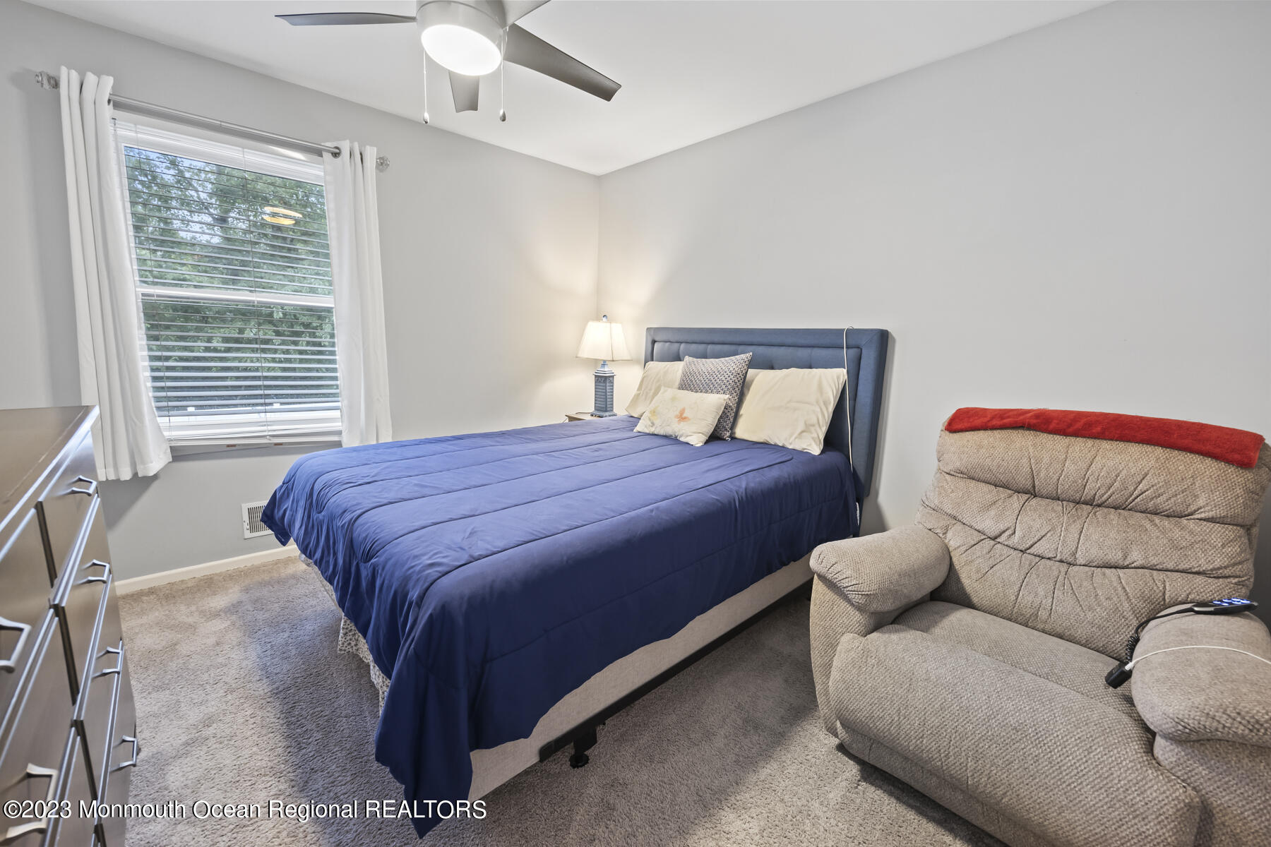 12 Constitution Drive Howell, NJ 07731 - Photo 27 of 39 a bedroom with a bed couch and window
