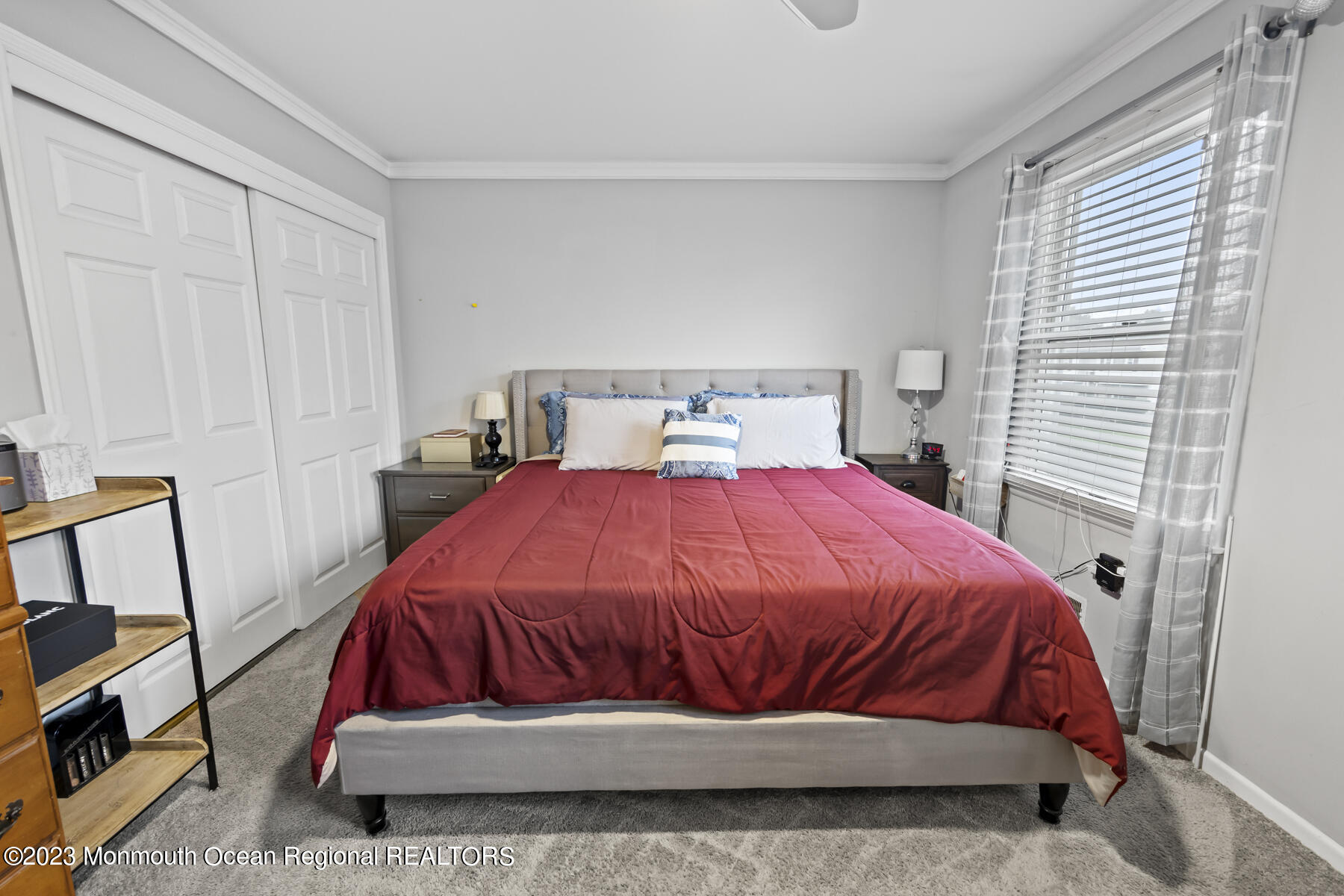 12 Constitution Drive Howell, NJ 07731 - Photo 29 of 39 a bed sitting in a bedroom next to a window