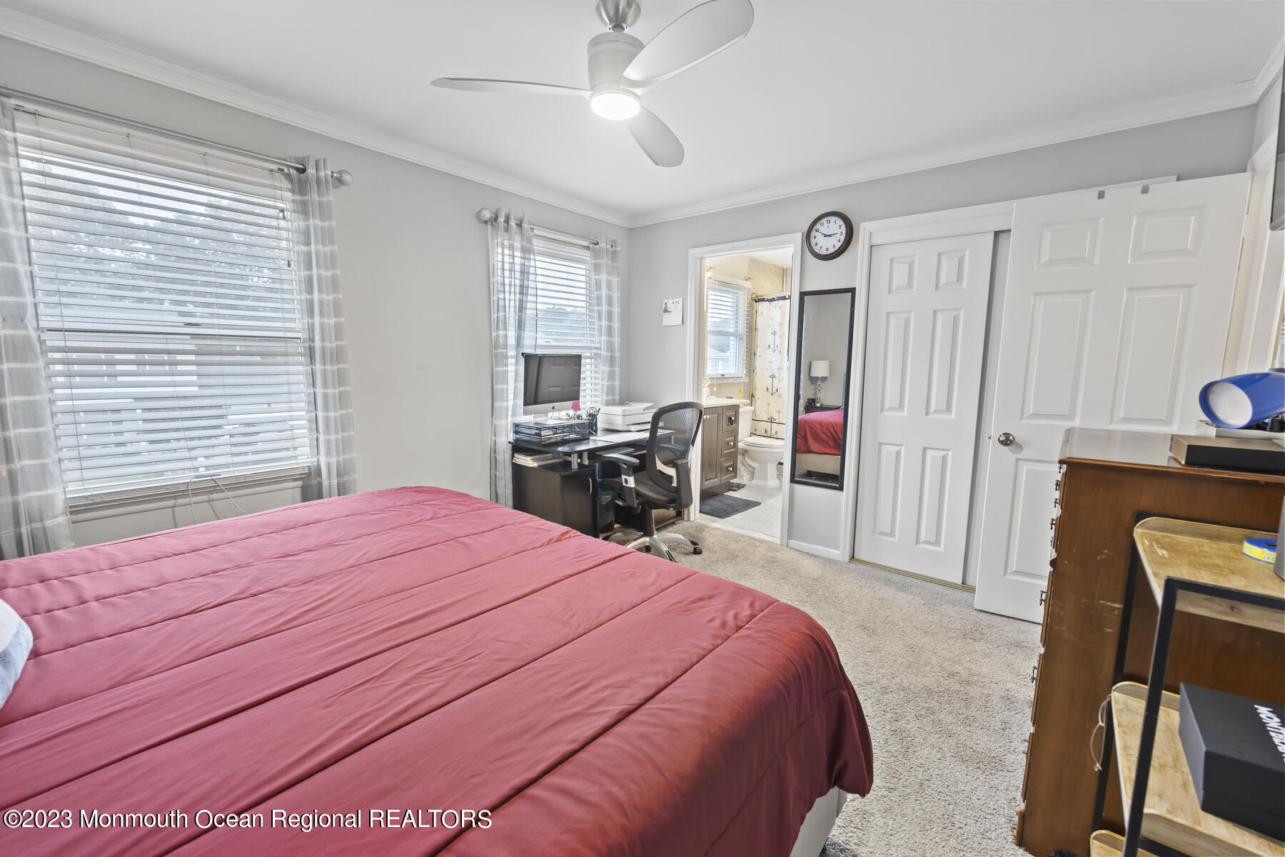 12 Constitution Drive Howell, NJ 07731 - Photo 30 of 39 a spacious bedroom with a bed a table and chair