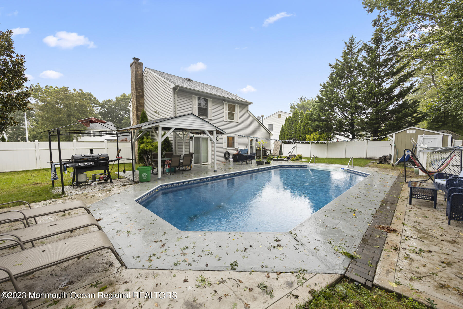 12 Constitution Drive Howell, NJ 07731 - Photo 37 of 39 a view of a swimming pool with a lounge chairs