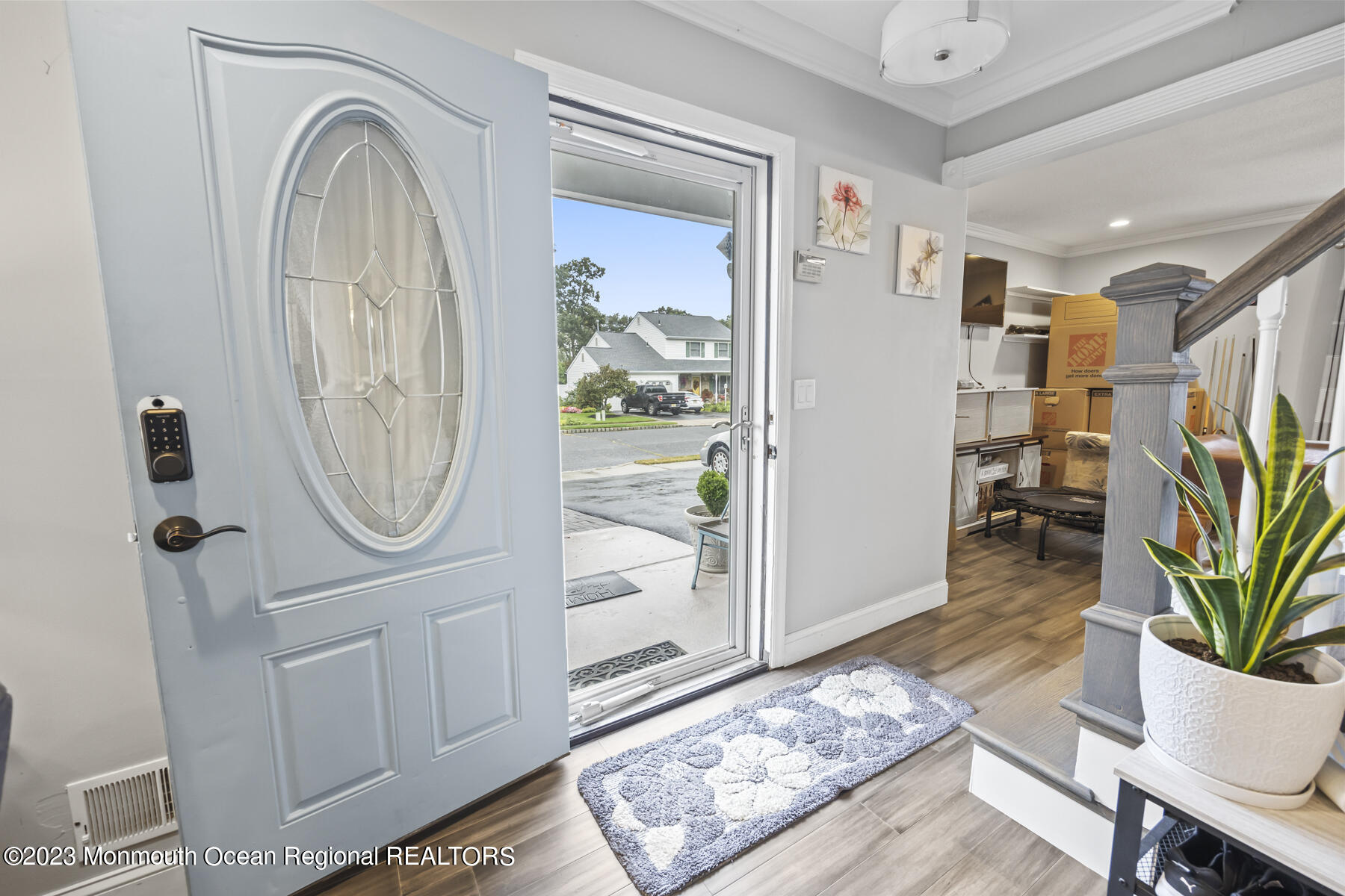 12 Constitution Drive Howell, NJ 07731 - Photo 5 of 39 a view of a hallway with entryway wooden floor and a rug