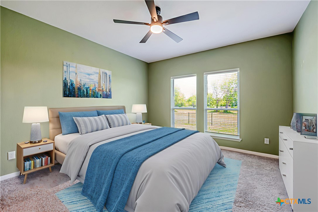 631 Friar Tuck Drive Temple, TX 76502 - Photo 17 of 36 a bedroom with a bed and a chandelier