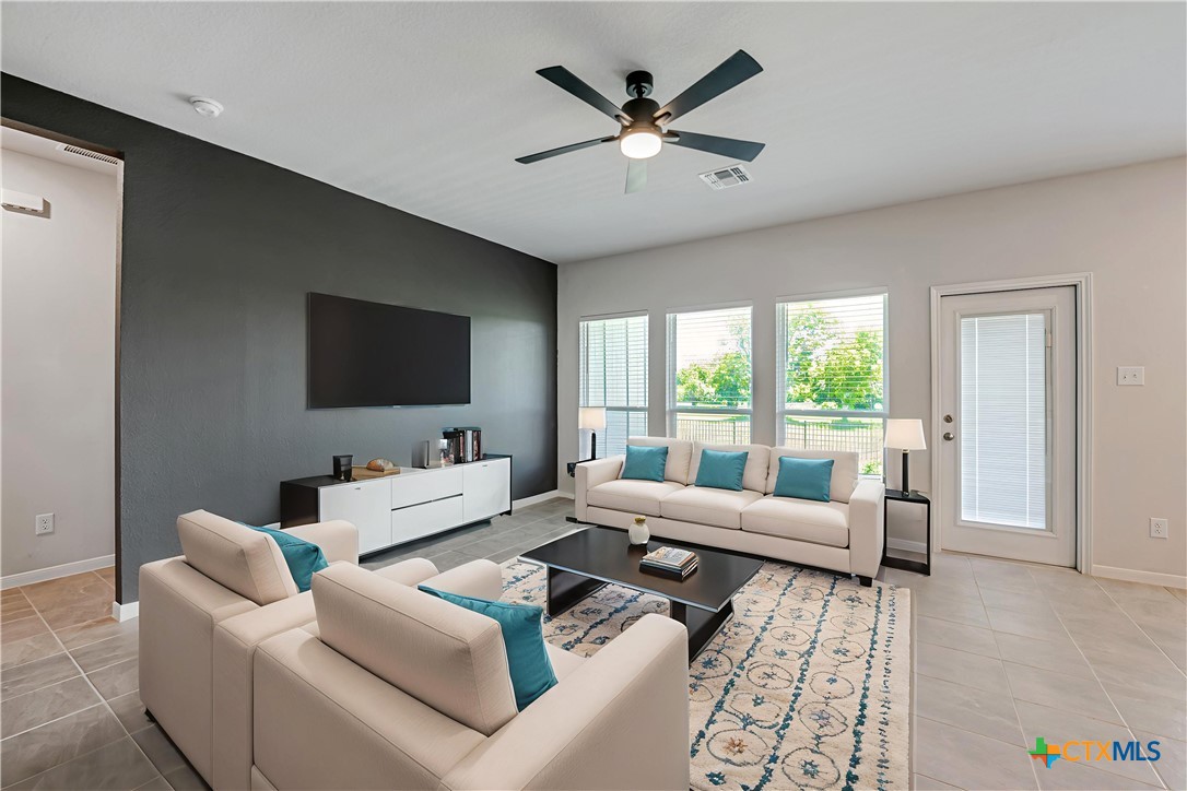 631 Friar Tuck Drive Temple, TX 76502 - Photo 7 of 36 a living room with furniture and a flat screen tv
