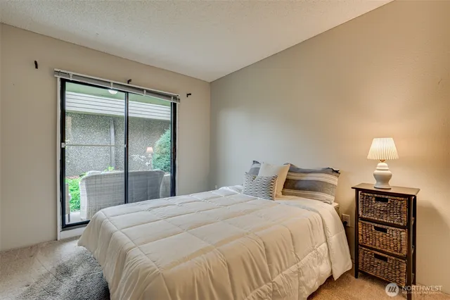 a bed room with a bed and a mirror