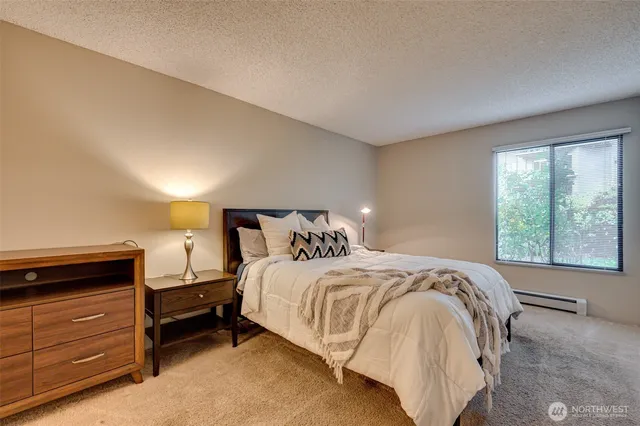 a bathroom with a sink toilet and a mirror