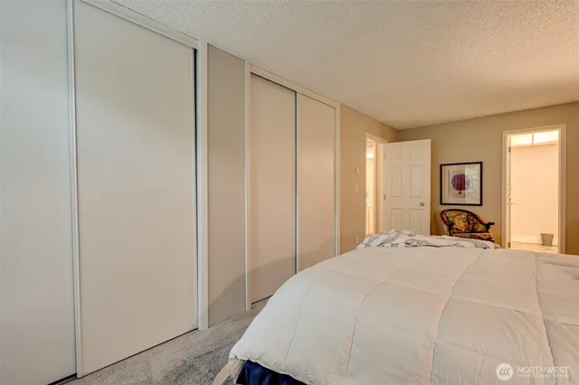 a bathroom with a sink and mirror with bathtub