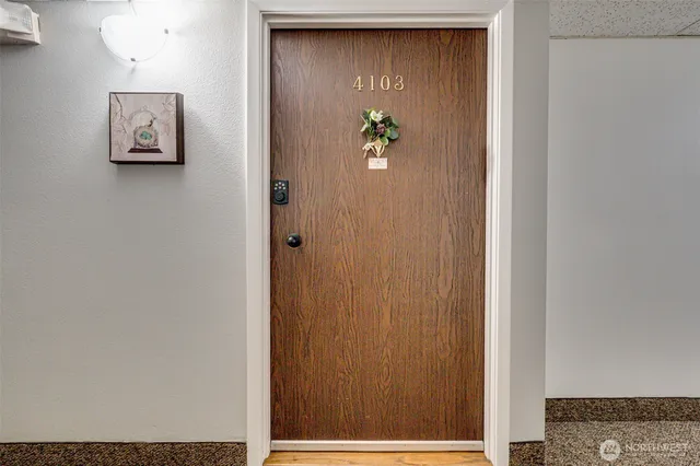 a kitchen with a stove a sink and a microwave