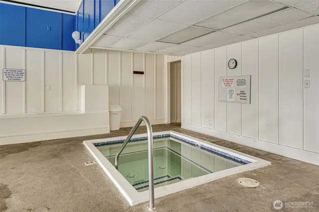 a view of a room with furniture and window