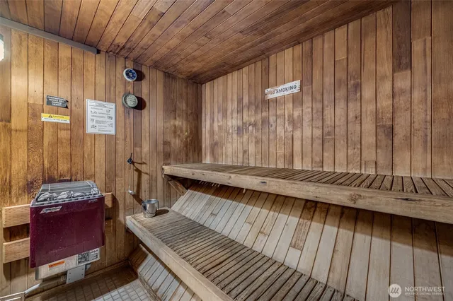 a room with furniture pool table gym equipment wooden floor and window