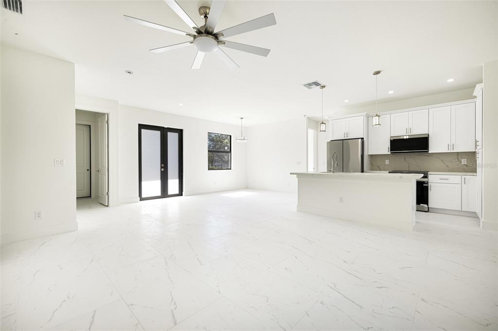 355 Milton Street Port Charlotte, FL 33954 - Photo 12 of 45 a view of kitchen with stainless steel appliances refrigerator oven and cabinets