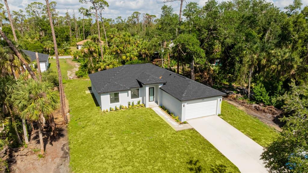 355 Milton Street Port Charlotte, FL 33954 - Photo 2 of 45 front view of a house with a yard