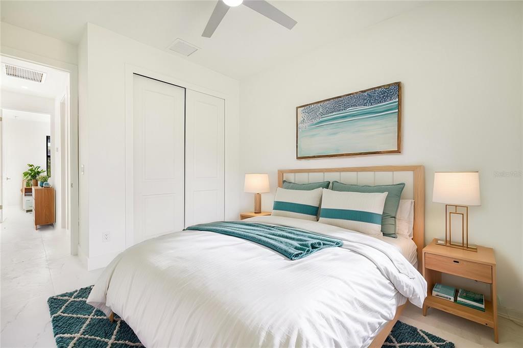 355 Milton Street Port Charlotte, FL 33954 - Photo 28 of 45 a bedroom with a bed and a lamp