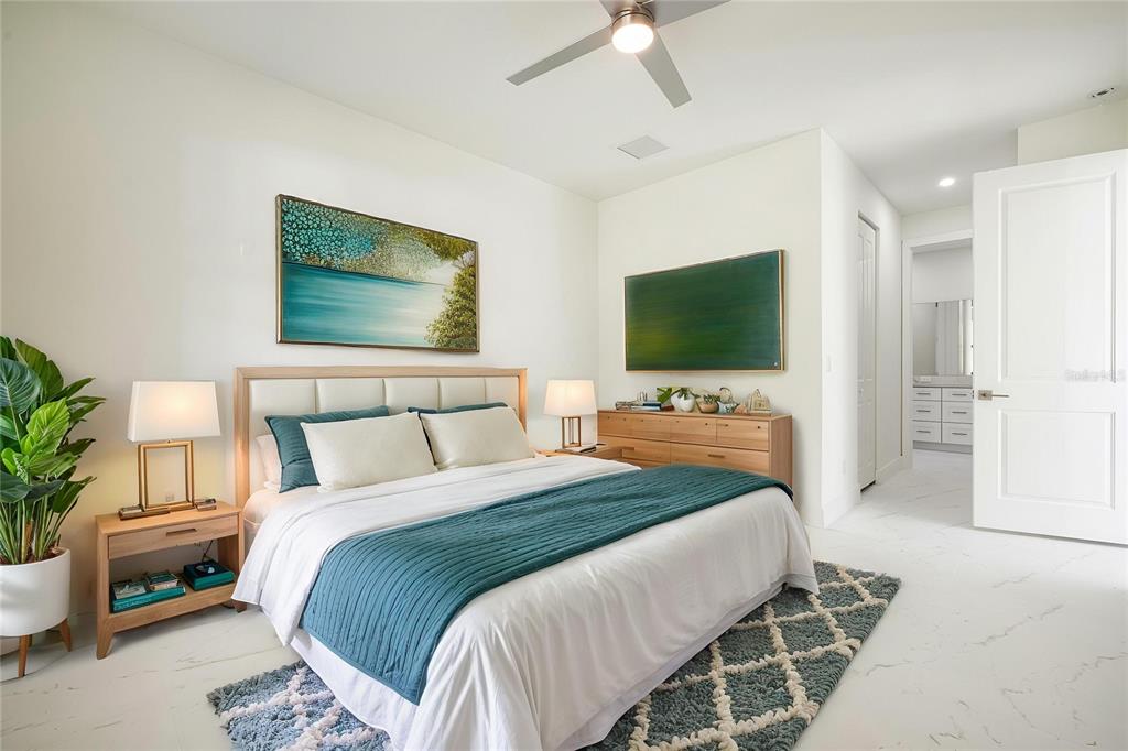 355 Milton Street Port Charlotte, FL 33954 - Photo 33 of 45 a bedroom with a bed and a flat screen tv