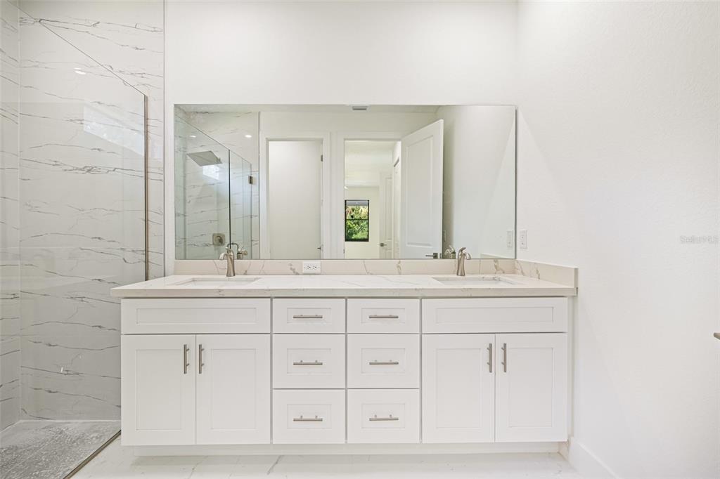 355 Milton Street Port Charlotte, FL 33954 - Photo 36 of 45 a bathroom with double sink and a mirror