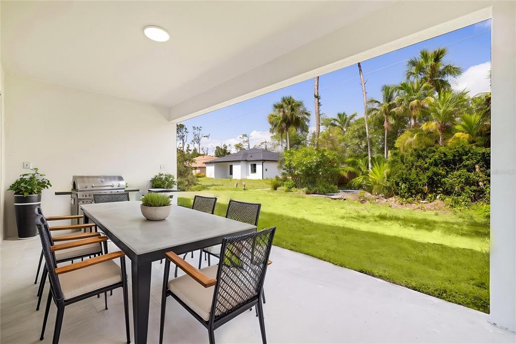 355 Milton Street Port Charlotte, FL 33954 - Photo 39 of 45 a view of an chairs and table in the patio