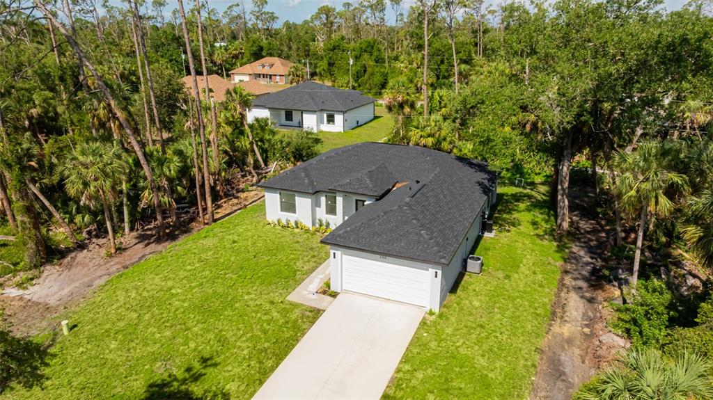 355 Milton Street Port Charlotte, FL 33954 - Photo 43 of 45 a front view of a house with a yard