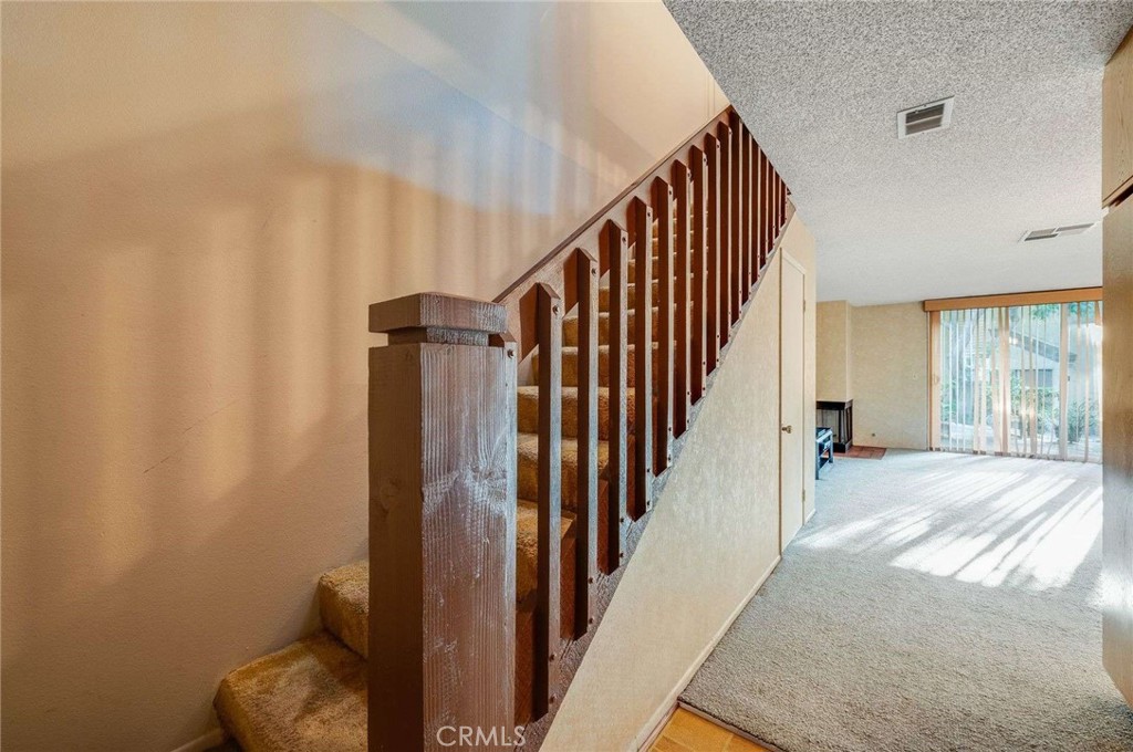 4140 Workman Mill Road, Unit 170 Whittier, CA 90601 - Photo 12 of 32 a view of entryway and hall with wooden floor