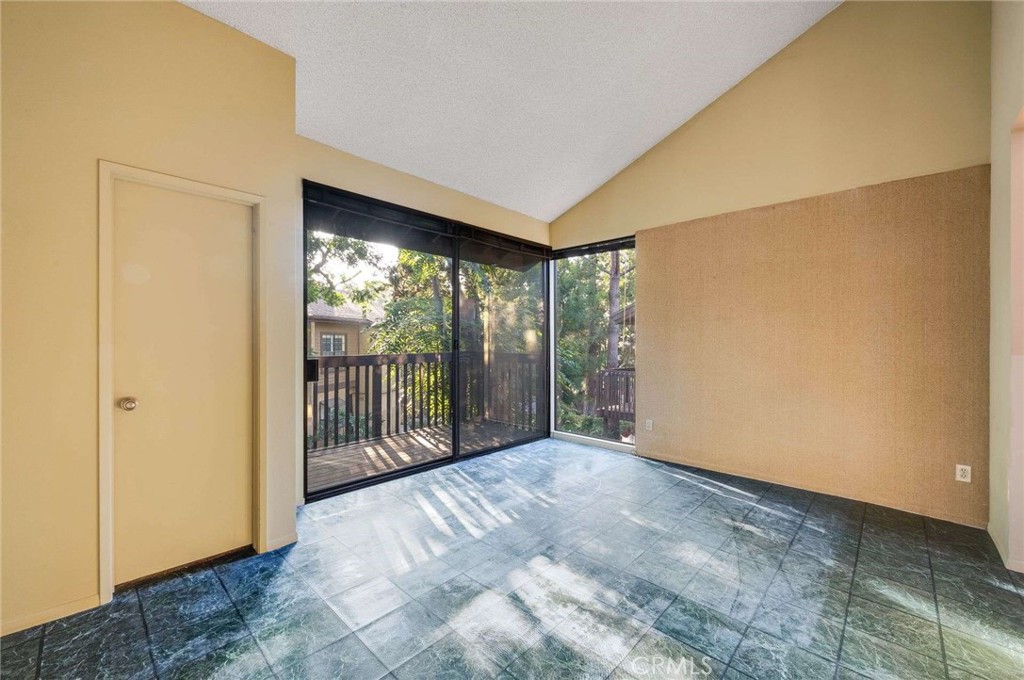 4140 Workman Mill Road, Unit 170 Whittier, CA 90601 - Photo 18 of 32 a view of an empty room with wooden floor and a window