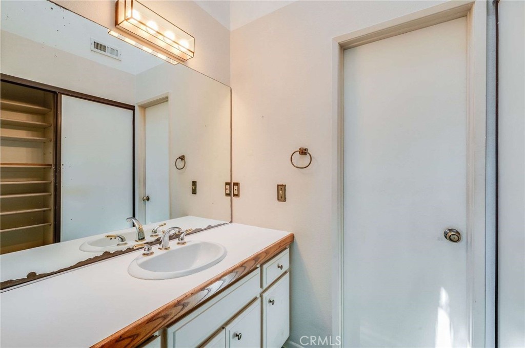 4140 Workman Mill Road, Unit 170 Whittier, CA 90601 - Photo 21 of 32 a bathroom with a sink and a mirror