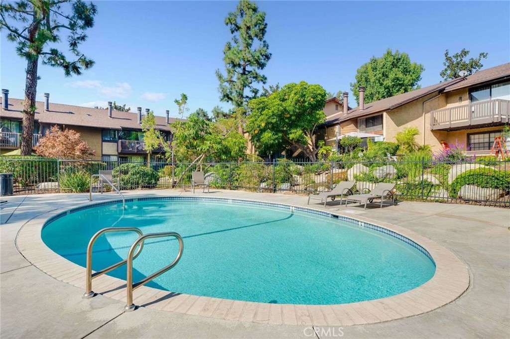 4140 Workman Mill Road, Unit 170 Whittier, CA 90601 - Photo 25 of 32 a view of a swimming pool with a patio